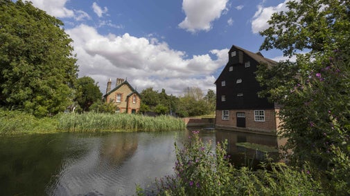 The Great Ouse river running past Houghton Mill, Cambridgeshire
